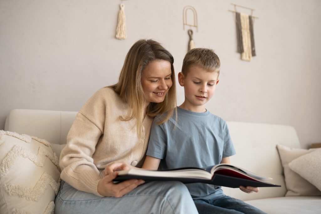 A mom and son reading a book