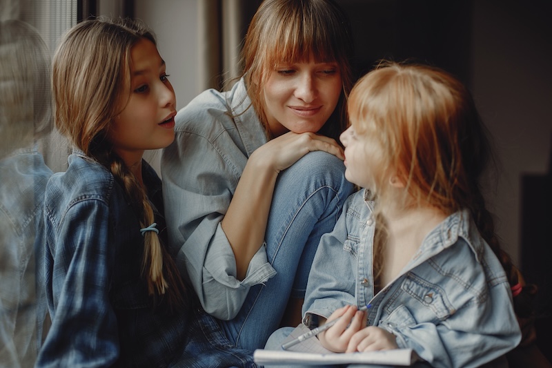 A mother and her daughters at home