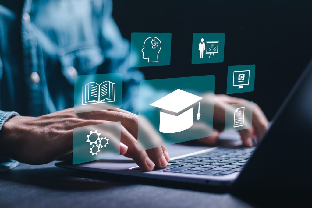 A businessman uses a laptop with online learning icons and webinars on the internet. Enhancing business skills. Internet technology in education. The concept of online education.