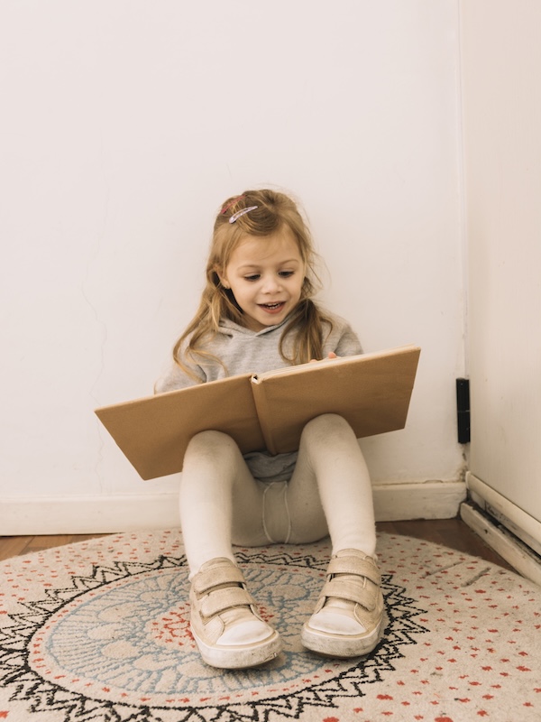 funny-girl-reads-on-the-wall