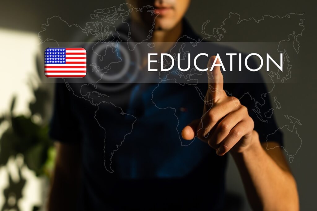 Inspiration demonstrating the Creative Education label. Business overview: students are able to use imagination and critical thinking. In a suit, holding his index finger on a futuristic virtual button.