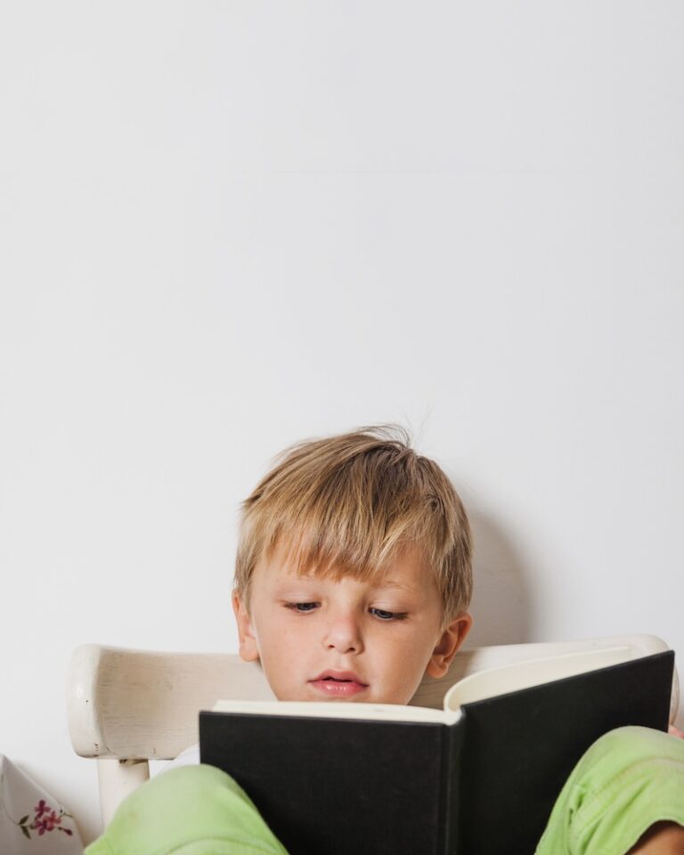 The child is reading a book.