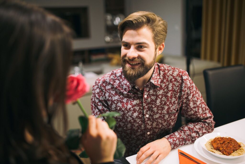 A man gives a rose to a girl