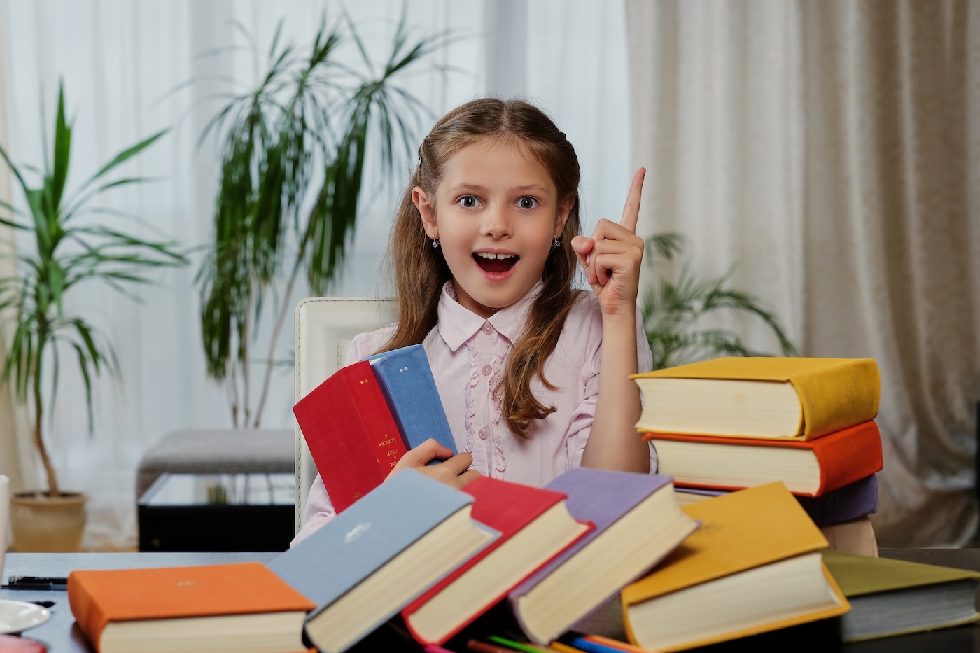 Positive little girl likes reading