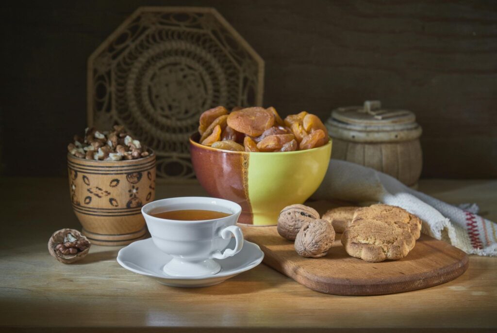 Cup of tea, nuts, dried apricots