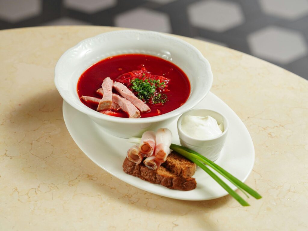 Borscht, bread, green onions, sour cream