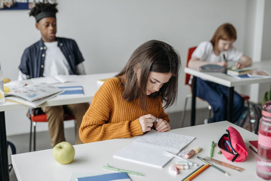 Three children in a classroom