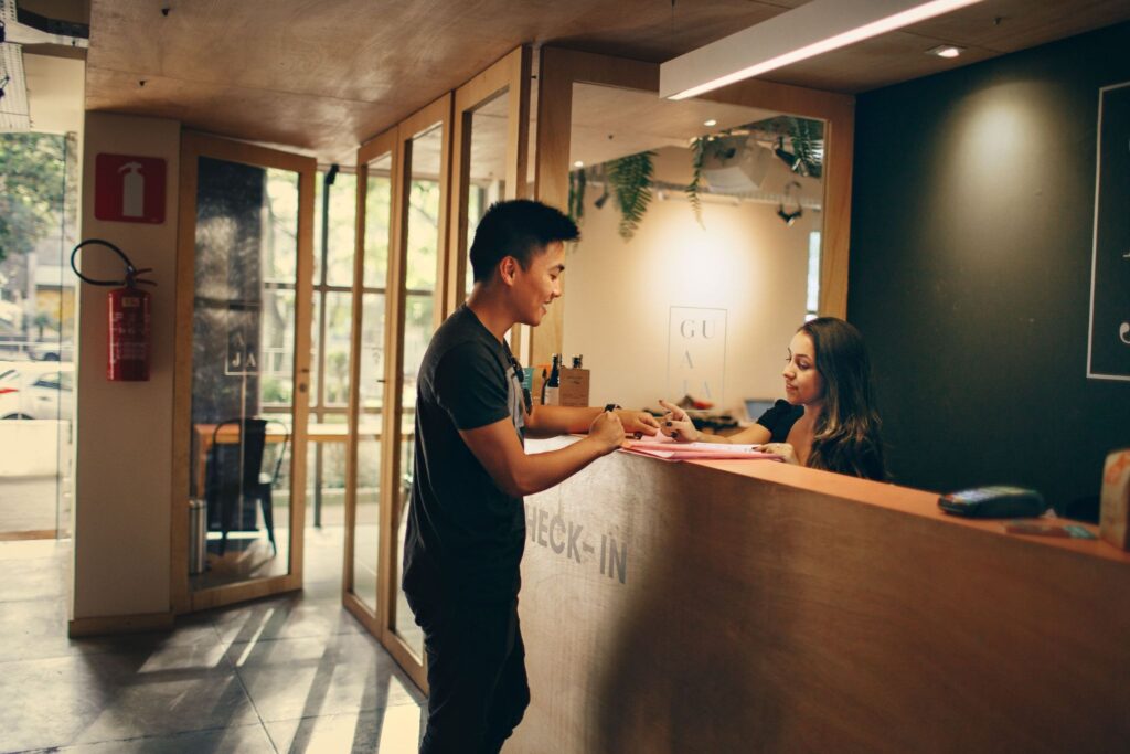 The guest is being processed at the hotel reception.