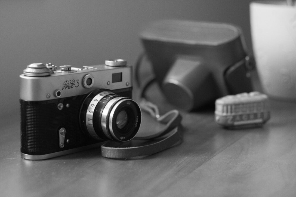 Old film camera on the table
