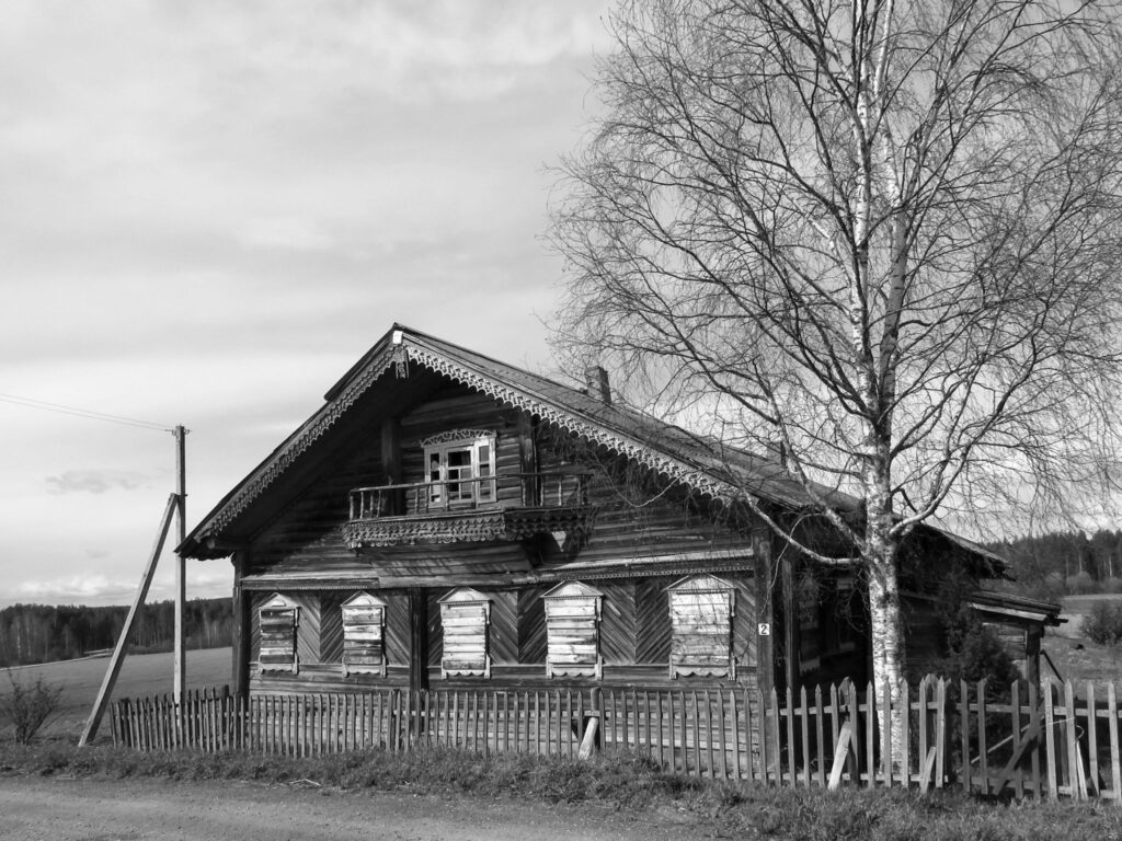 Old wooden house with a boarded-up window