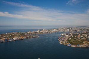 Panorama of the Zolotoy Rog bay with the port wharves and the urban districts of Vladivostok.