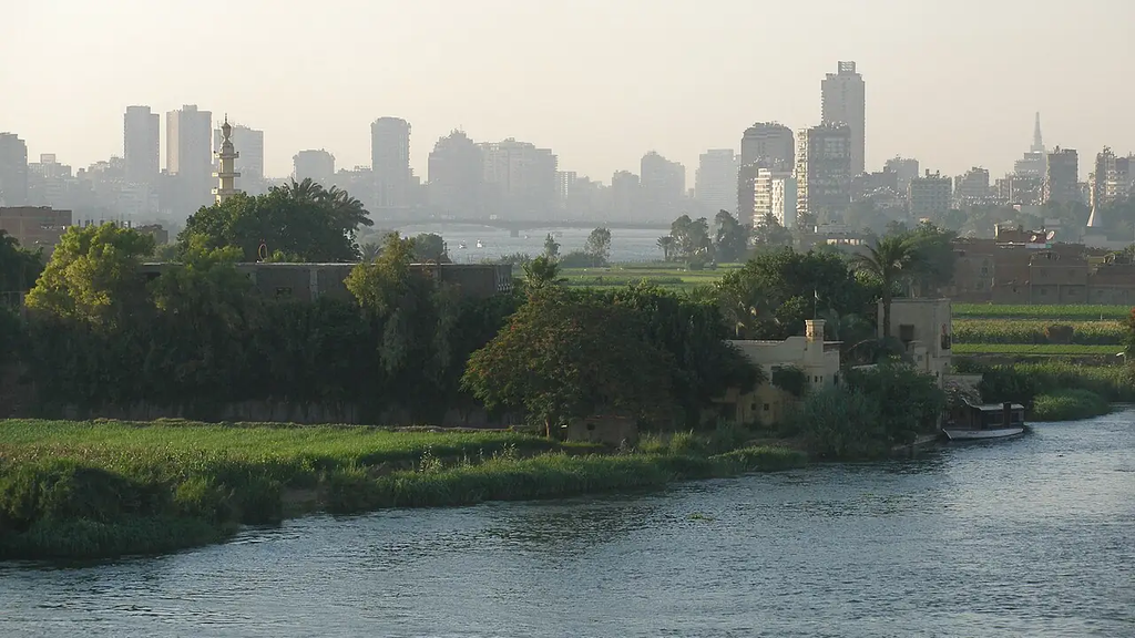 The Nile, green areas by the water and the houses of Cairo. Photo from 2007.